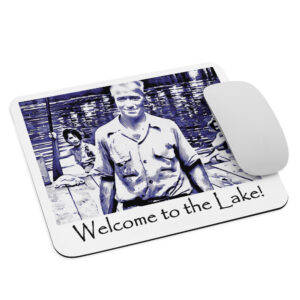 mouse pad white front with image of the book cover for 'The History of Silver Lake' showing an elderly man, Pappy, in foreground, two young women in a canoe behind him, and a young girl peeking from behind a tree saying ‘Welcome to the Lake’ on the historyofsilverlake.com website.