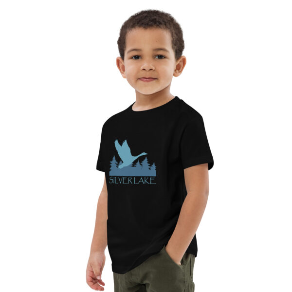 organic cotton kids t shirt black left front with a stylized teal blue logo for 'History of Silver Lake' book: A single goose flying over Silver Lake with trees in the background.