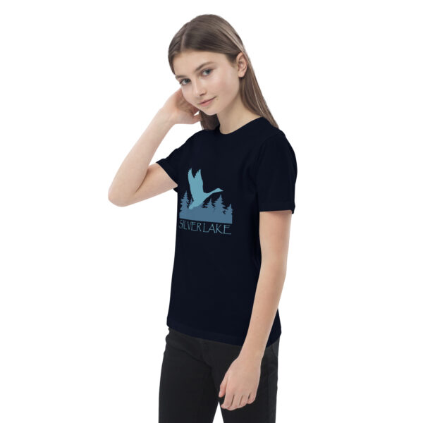 organic cotton kids t shirt french navy left front with a stylized teal blue logo for 'History of Silver Lake' book: A single goose flying over Silver Lake with trees in the background.