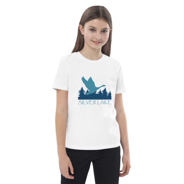 organic cotton kids t shirt white front 2 with a stylized teal blue logo for 'History of Silver Lake' book: A single goose flying over Silver Lake with trees in the background.