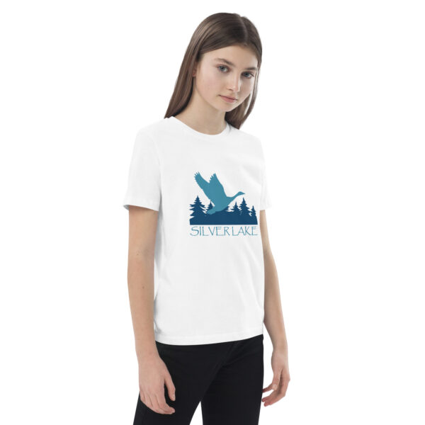 organic cotton kids t shirt white right front with a stylized teal blue logo for 'History of Silver Lake' book: A single goose flying over Silver Lake with trees in the background.