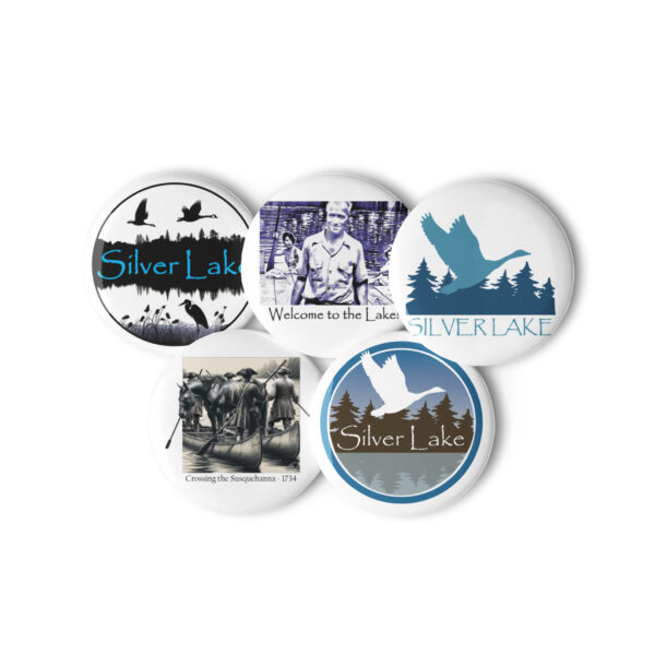 set of pin buttons white 1.25 front 2 with this delightful set of pin buttons capturing iconic moments from 'The History of Silver Lake.' From the daring feat of canoeing a horse across the Susquehanna River to the warm welcome extended by Pappy and his companions, each image embodies the rich tapestry of stories woven throughout Silver Lake's history.