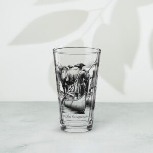 shaker pint glass 16 oz 16 oz front with image depicting Ellis Lewis crossing the Susquehanna River in 1734. A hobbled and blindfolded horse stands astride two canoes, guided by four Quakers paddling as found in ‘The History of Silver Lake” on the historyofsilverlake.com website.