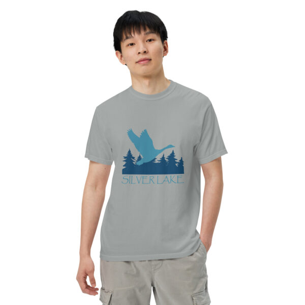 unisex garment dyed heavyweight t shirt granite front with a stylized teal blue logo for 'History of Silver Lake' book: A single goose flying over Silver Lake with trees in the background.