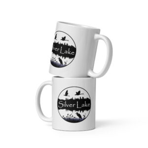 white glossy mug white 11 oz front view with a circular image of Silver Lake with a blue heron in the foreground and Canadian Geese flying over the lake taken from "The History of Silver Lake as Told Through Its Deeds".