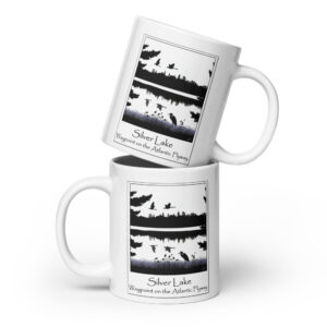 white glossy mug white 20 oz front view with an image of Silver Lake featuring a blue heron in the foreground and Canada Geese in flight overhead, highlighting Silver Lake as a waypoint on the American Atlantic Flyway from the book "The History of Silver Lake as Told Through Its Deeds".