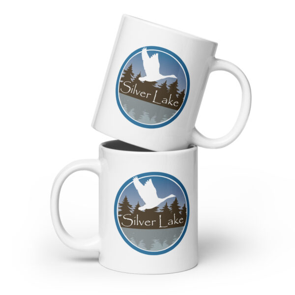 white glossy mug white 20 oz front view with the logo for 'The History of Silver Lake' book by authors Scott Webb and Kathleen Webb: A circular design depicting Canada Geese flying over Silver Lake.