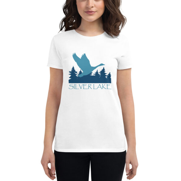 womens fashion fit t shirt white front with a stylized teal blue logo for 'History of Silver Lake' book: A single goose flying over Silver Lake with trees in the background.